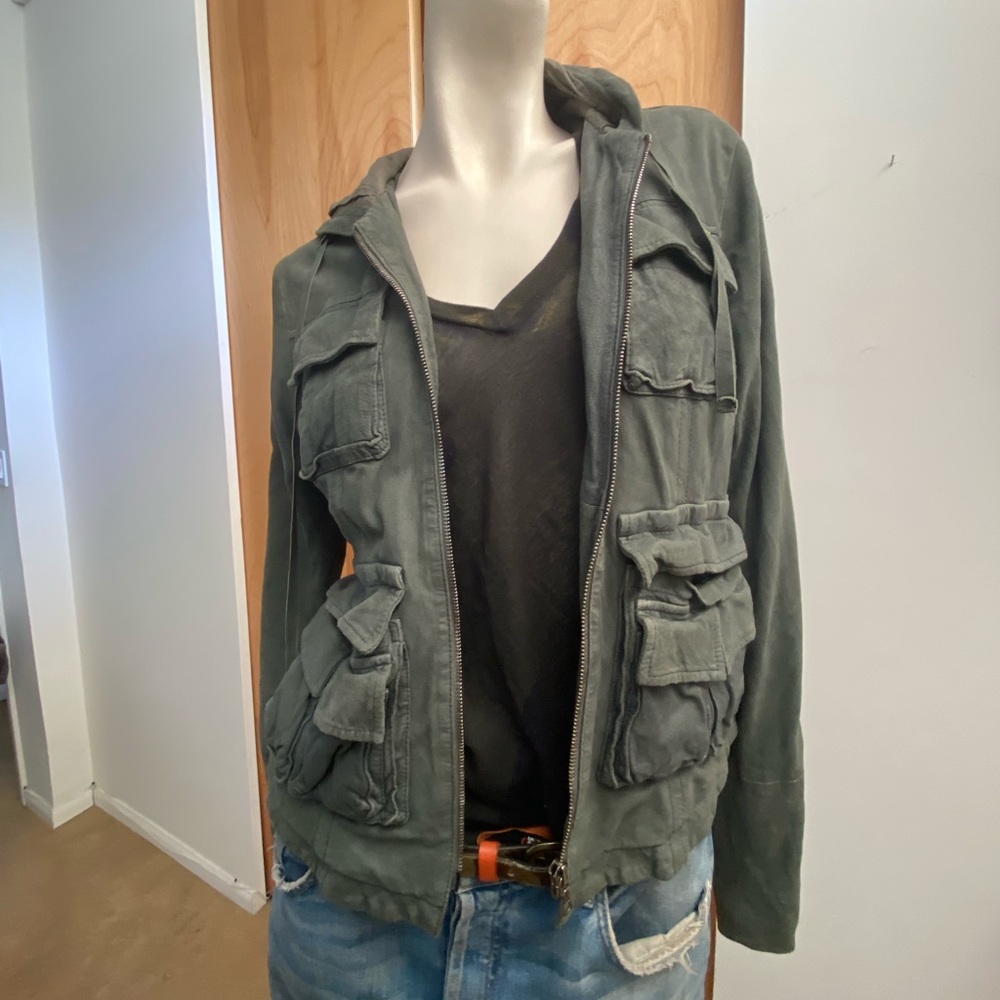Suede hooded jacket with multi pockets and cotton lining.